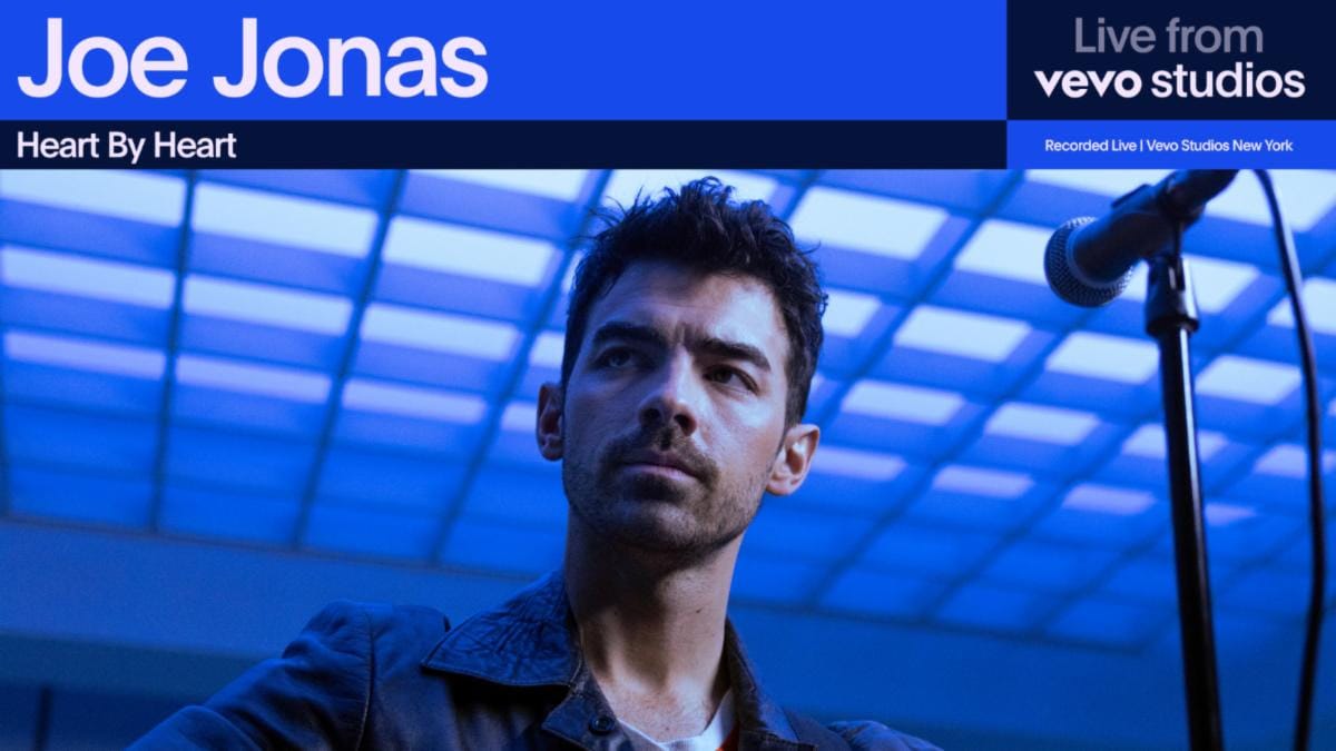 Joe Jonas headshot blue background