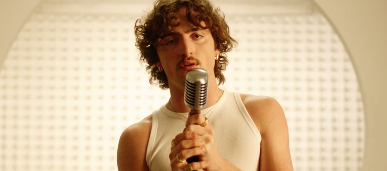 Benson Boone with microphone