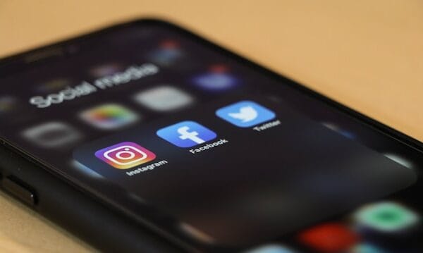 Sadly, I was scammed by Path Social social media icons displayed on a black phone