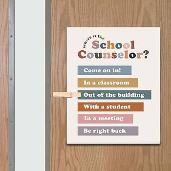 School Counselor sign on a wooden door noting the counselor is out of the building