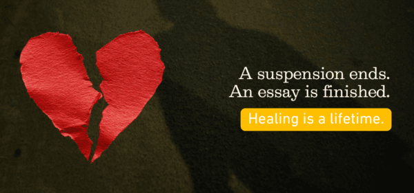 Broken heart, shadow on pavement, words that says A suspension ends. An essay is finished. Healing is a lifeitme.