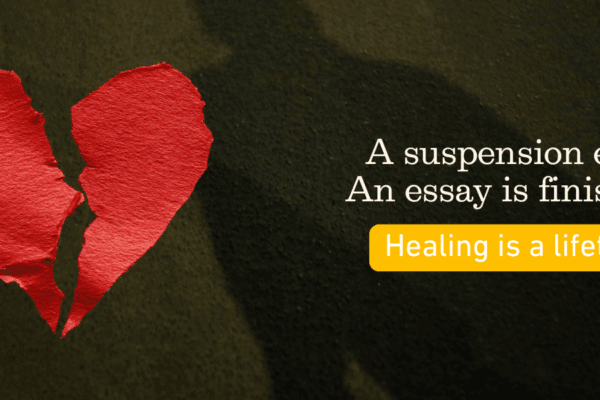 Broken heart, shadow on pavement, words that says A suspension ends. An essay is finished. Healing is a lifeitme.
